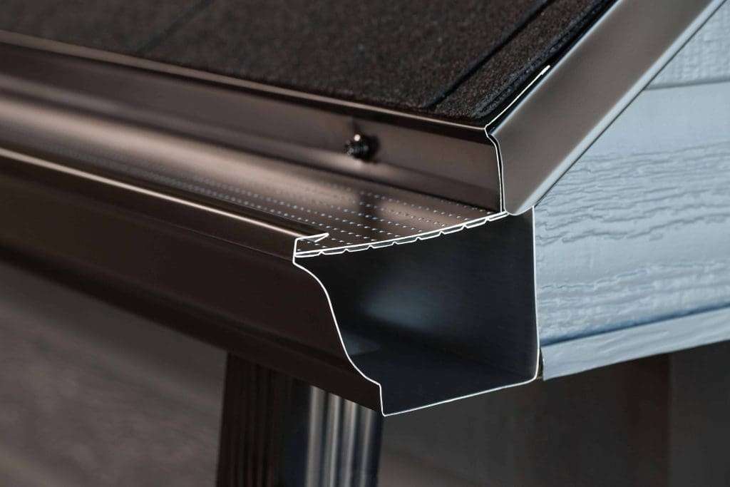 Gutter guard installation with micro-mesh protection for strong water flow in heavy rain