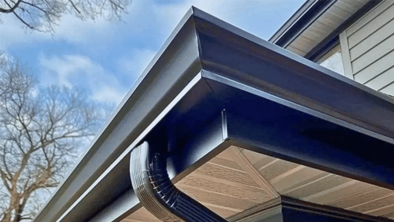 Hand-mitered aluminum eavestrough corner on a classic Mississauga brick house