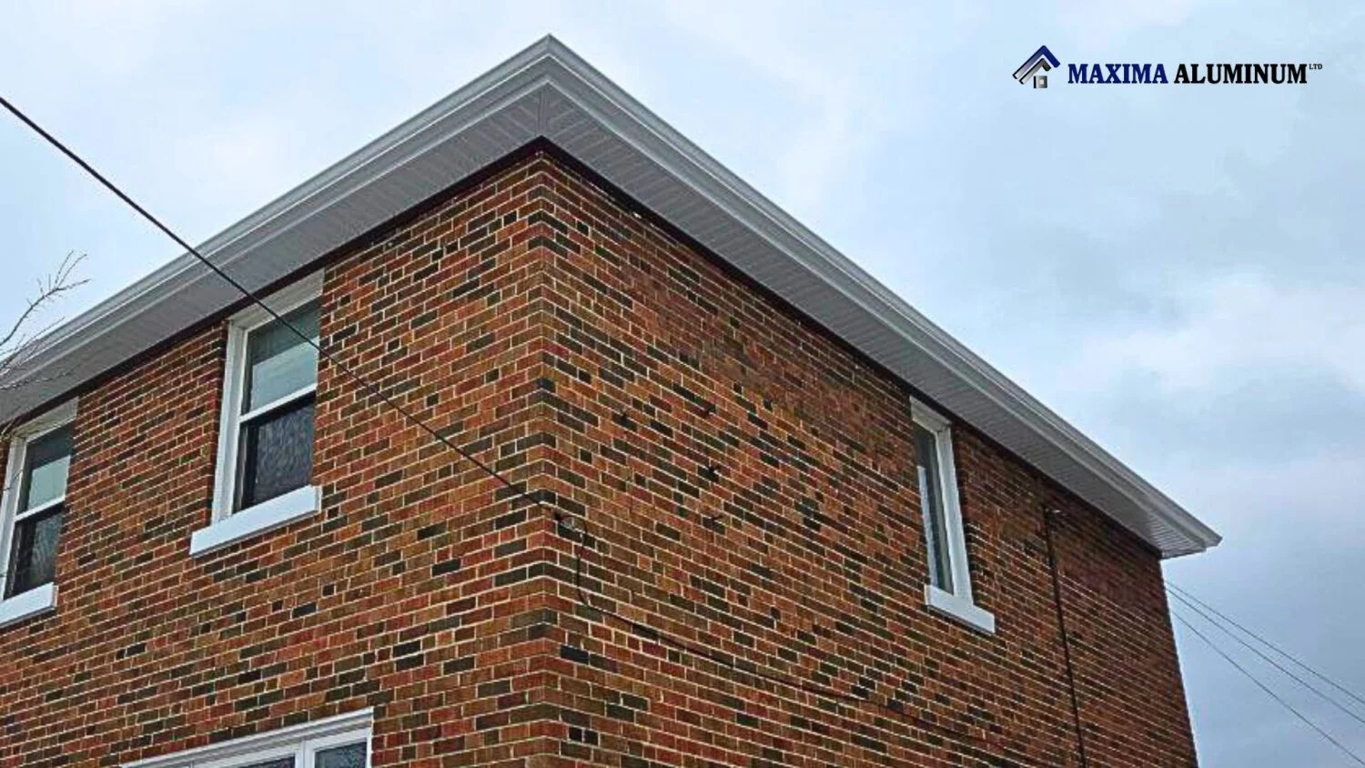 After: completed white soffit and fascia with new eavestrough and downspouts in North York