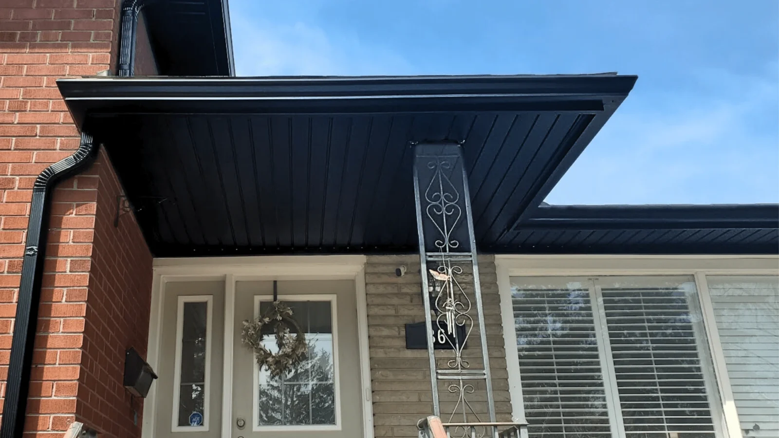 After image, Property in Mississauga, New black soffit, fascia and eavestrough with downspouts