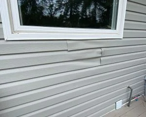 Siding damage caused by BBQ placement