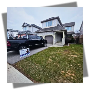 Eavestrough.to lawn sign in front of a Mississauga house with a freshly installed 5-inch aluminum eavestrough by Maxima Aluminum