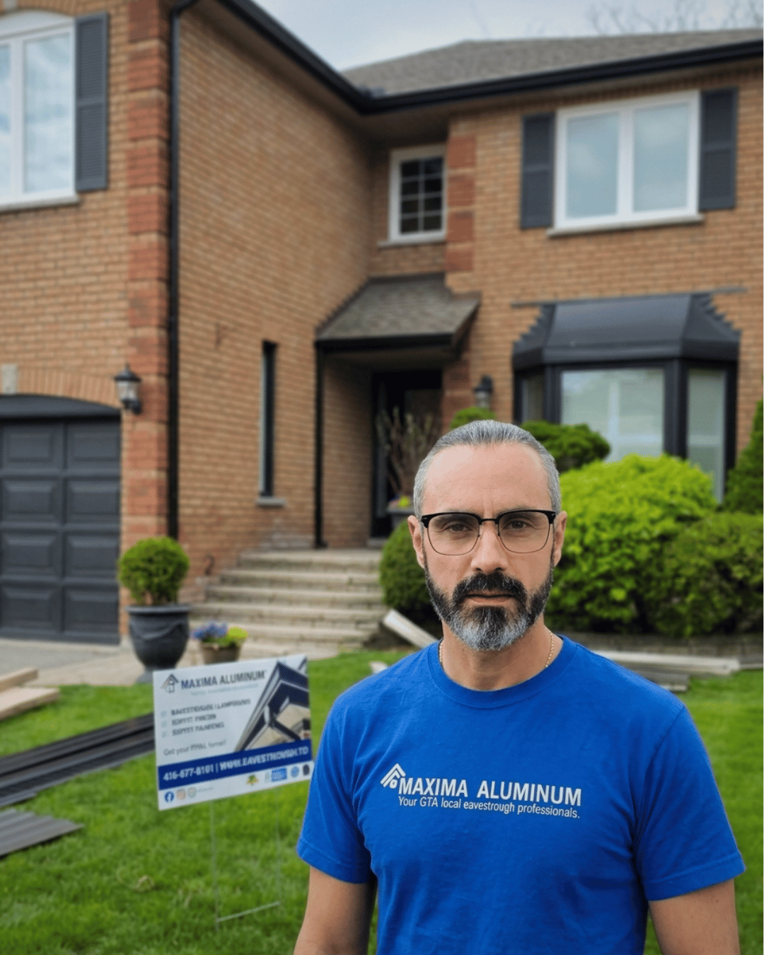 Gennadiy Polovynko, Owner of Maxima Aluminum LTD &mdash; certified Home and Construction Inspector, on-site with Maxima yard sign